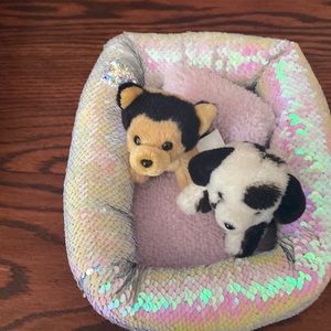 Justice toy dog bed with two stuffed dogs and reversible sequence